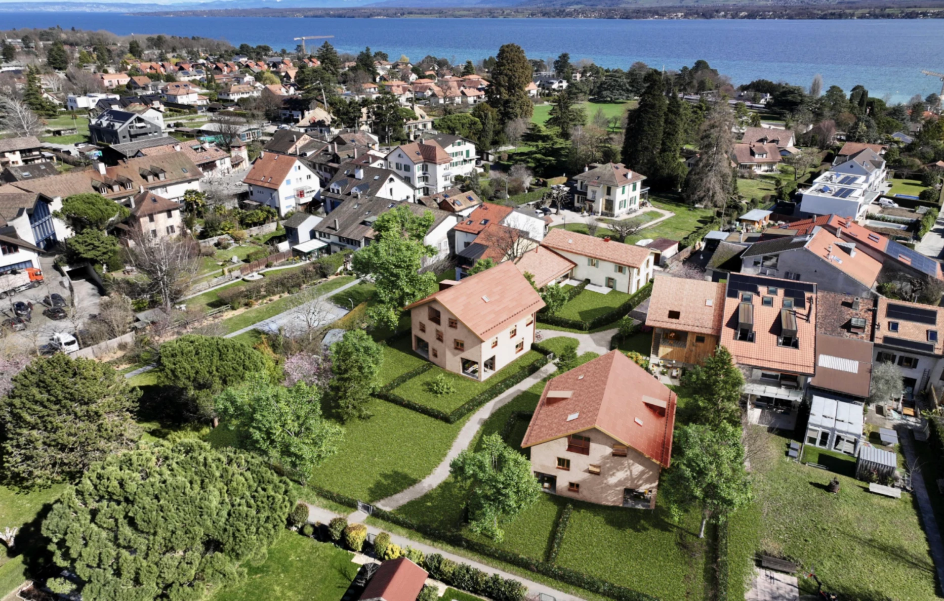 Construction de 2 immeubles d'habitation et une maison en plein centre d'un village, Bureau d'architecte à Genève, corpus architecture urbanisme